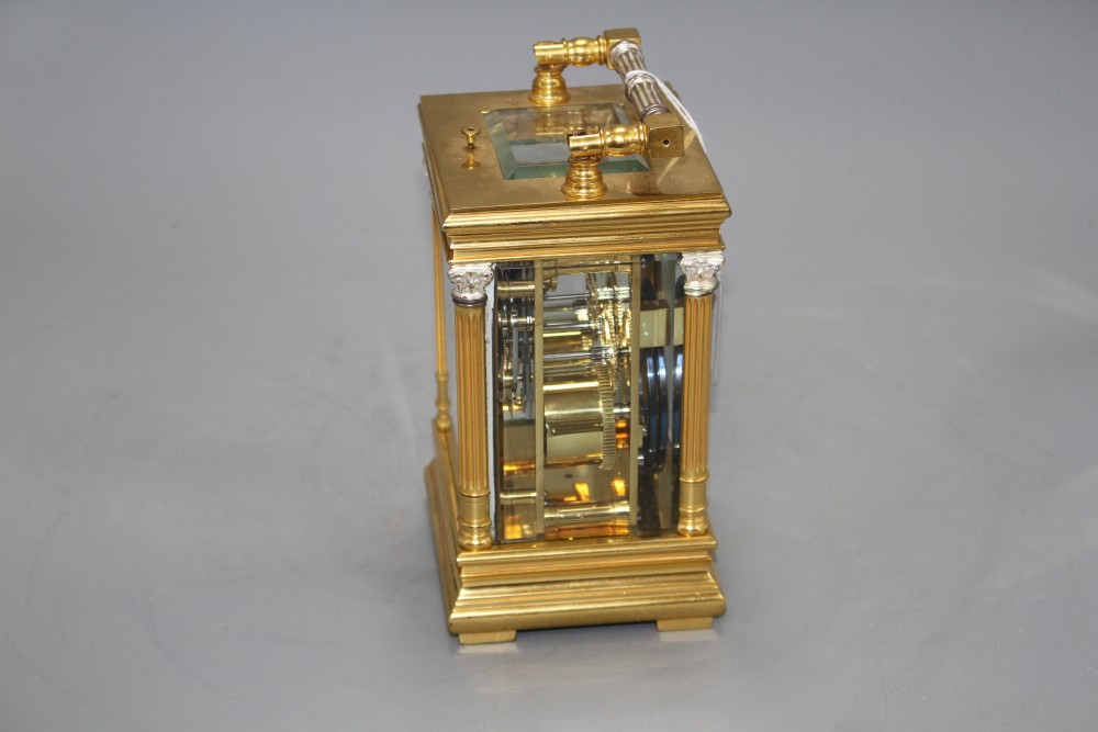 A 20th century silvered and gilt quarter repeating carriage clock